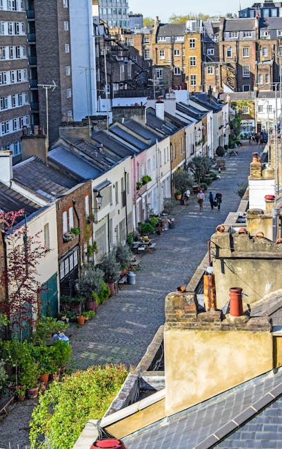 The image depicts a row of elegant Victorian-style terraced townhouses on Marylebone High Street, featuring cream-colored facades with decorative moldings and large sash windows. Each residence has sm